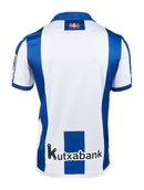 Camisa Real Sociedad l 24/25 - Torcedor Macron Masculina - Branca e azul