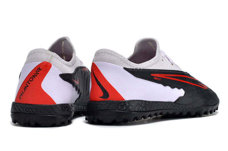 Chuteira de Campo Nike React Phantom GX Pro TF - Branco/Preto/Laranja