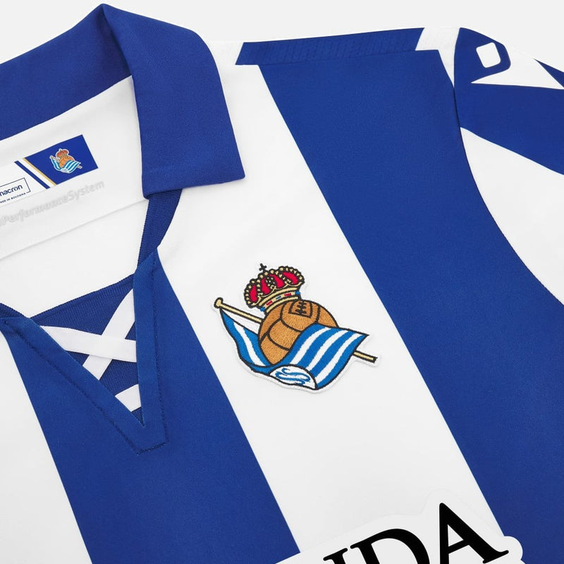 Camisa Real Sociedad l 24/25 - Torcedor Macron Masculina - Branca e azul