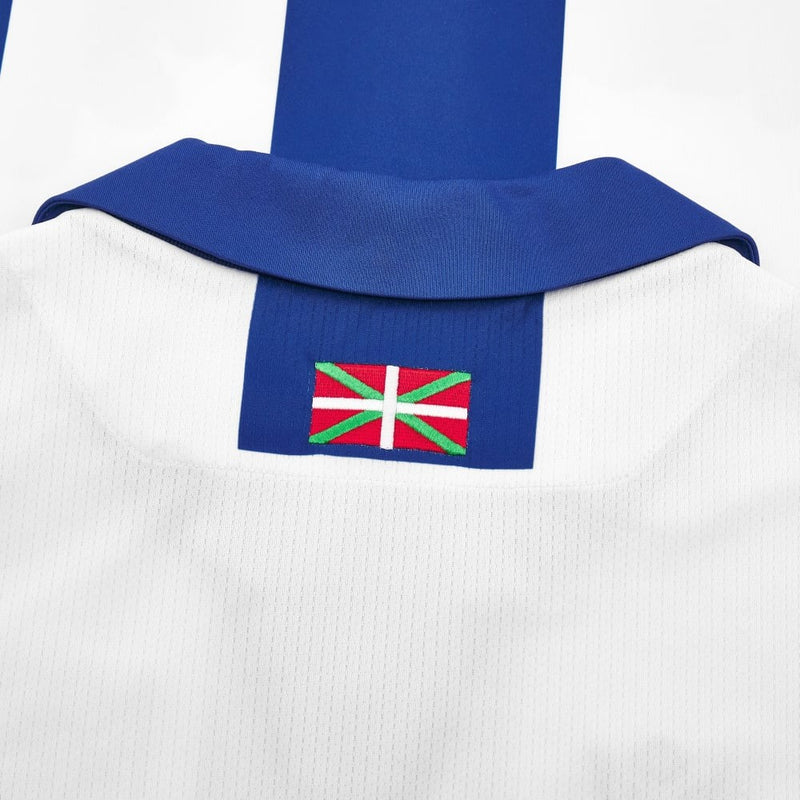 Camisa Real Sociedad l 24/25 - Torcedor Macron Masculina - Branca e azul